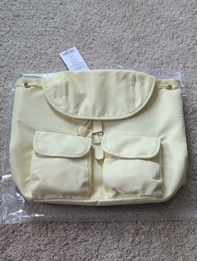 Year of Ours Soft Pale Yellow Drawstring Backpack with Front Pockets
